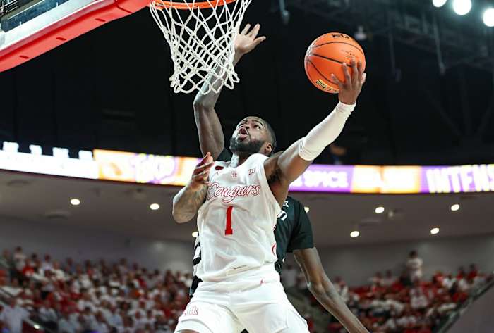 Houston Cougars guard Jamal Shead (1) shoots the ball during the second half against the Cincinnati Bearcats at Fertitta Center in Houston, Texas, Feb. 27, 2024.